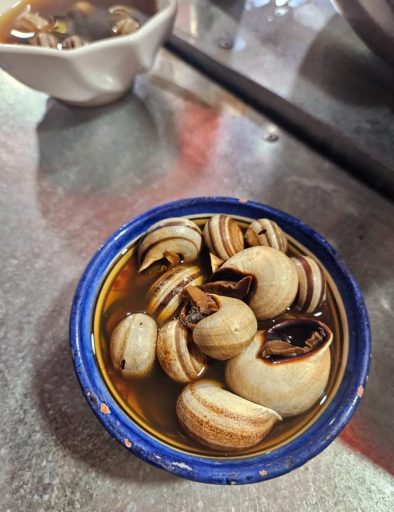 Babouch Snails simmering in the herbal broth